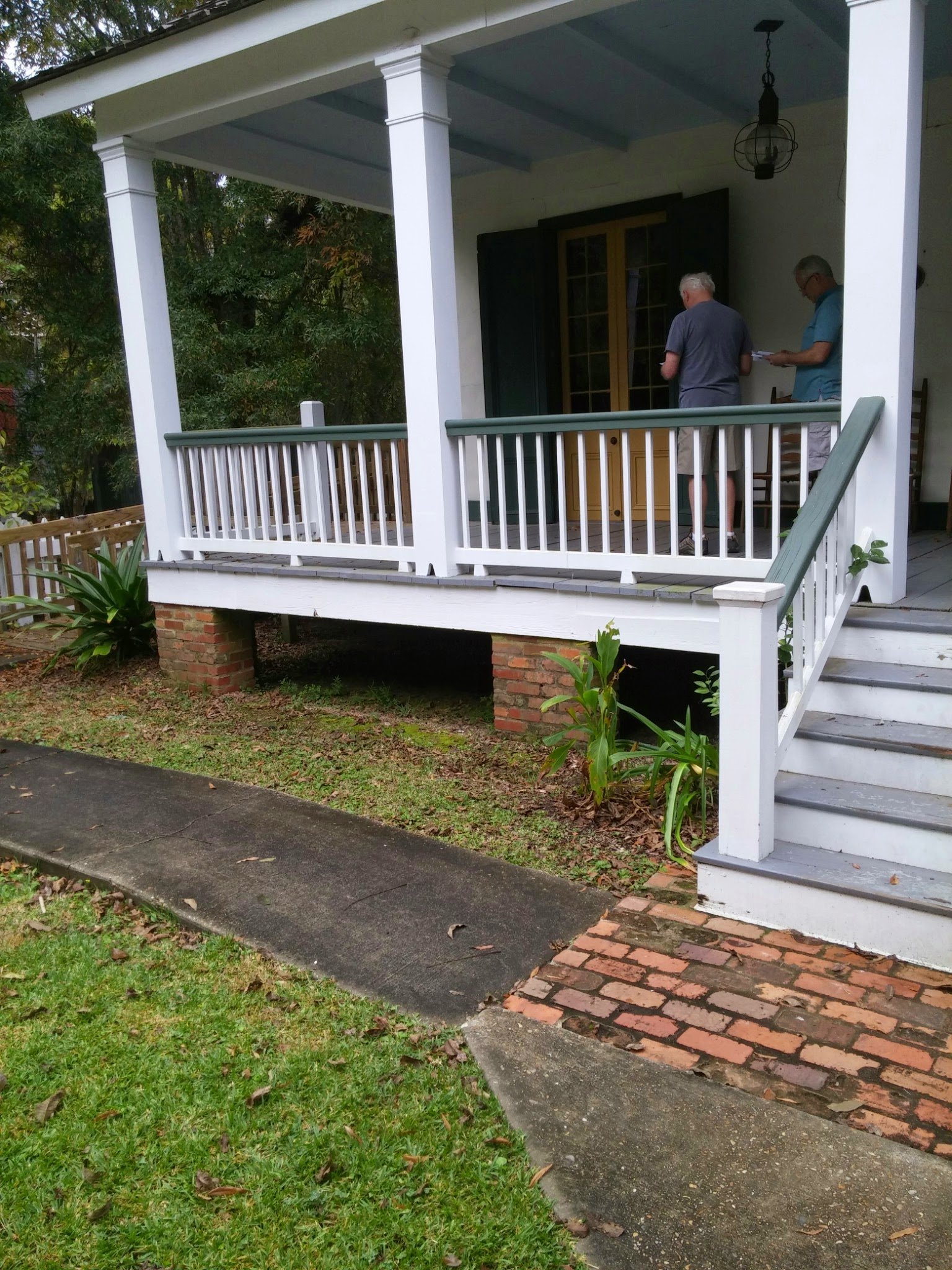 A house with a deep full-width front gallery on a row of posts