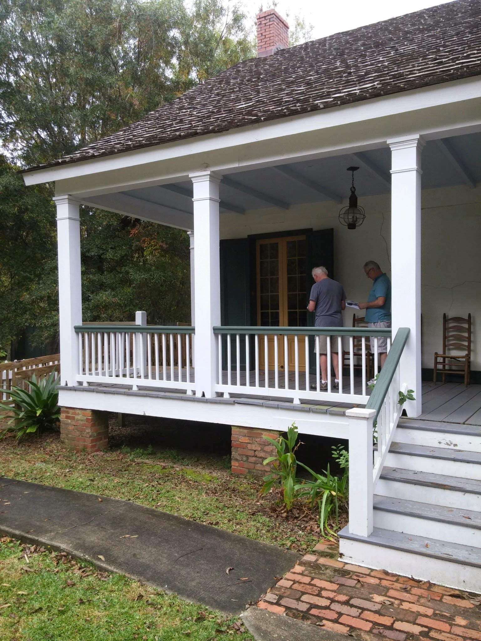Columns and an outside stair on a deep gallery