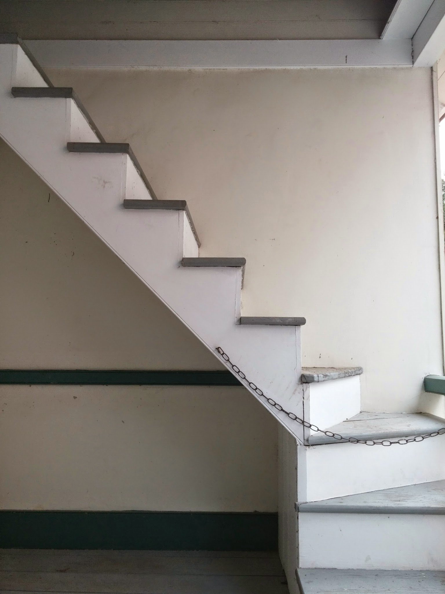 A staircase rising to the loft