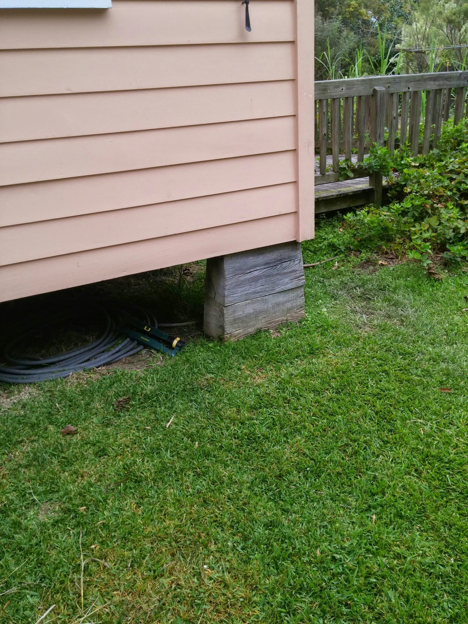 An Acadian house raised off the ground on piers