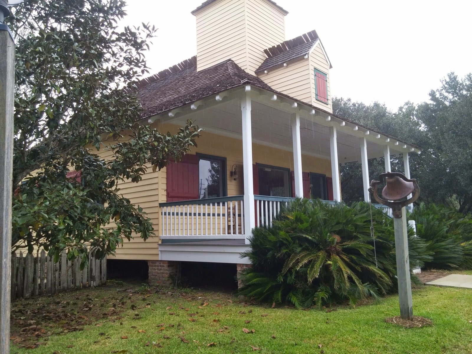 An Acadian cottage with a deep front porch at LARC's Acadian Village